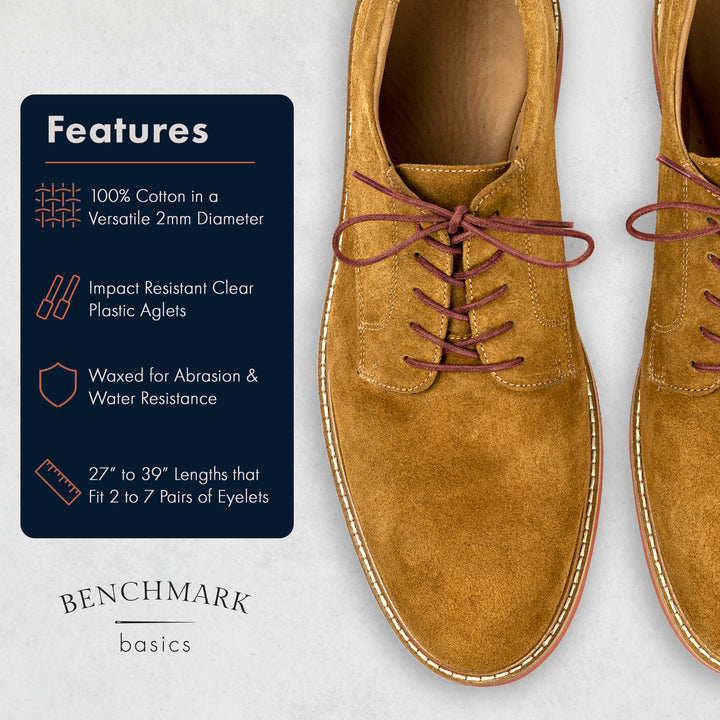 Brown suede shoes with laces on a light gray background, featuring Benchmark Basics branding. #color_brick-red