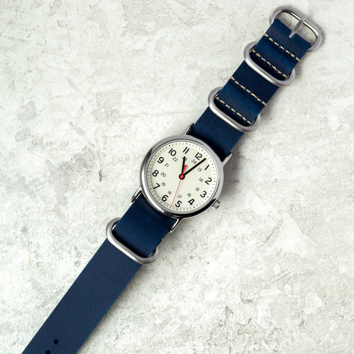 Wristwatch with a blue strap on a light gray background #color_navy-blue