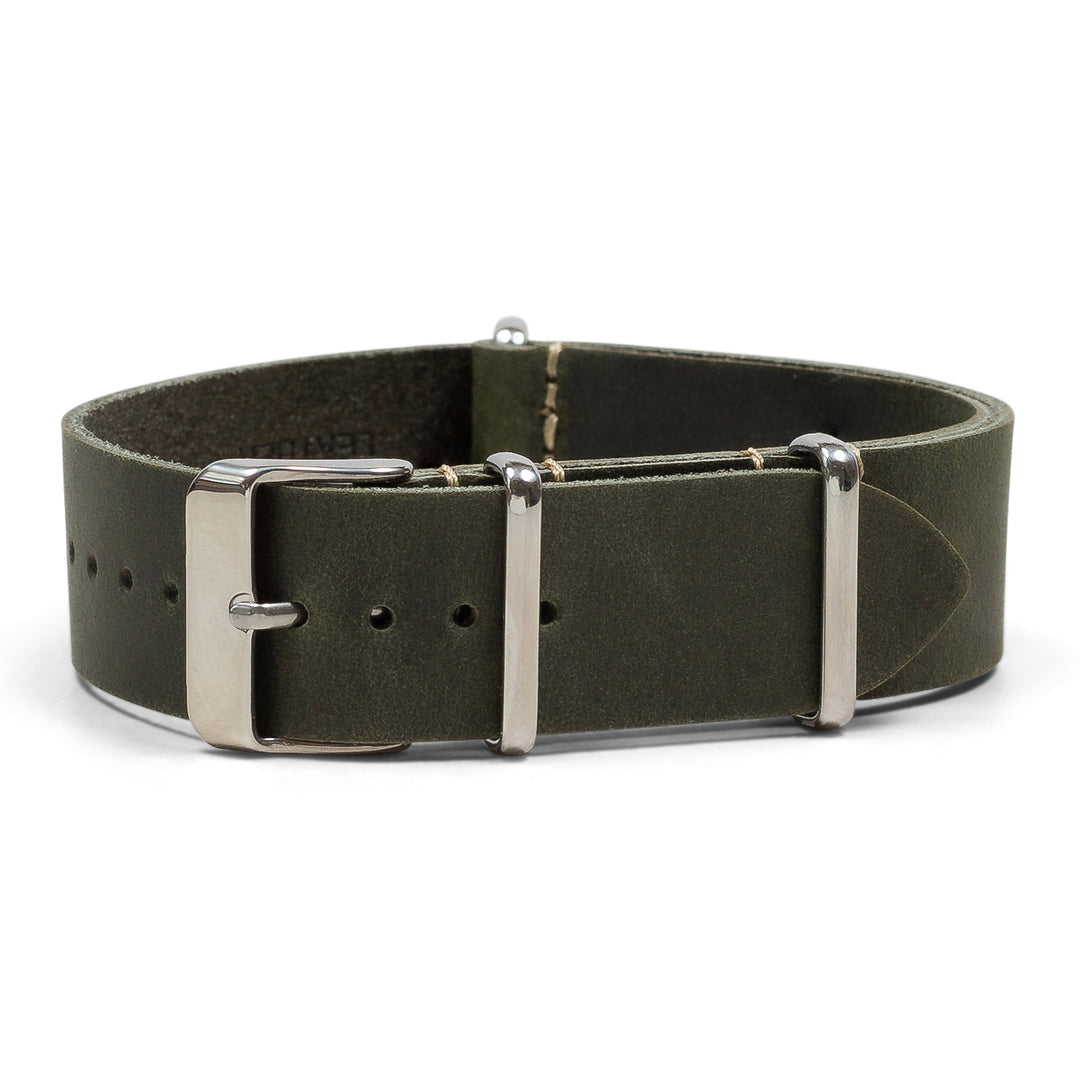 Green leather watch strap with silver buckle on a white background #color_green