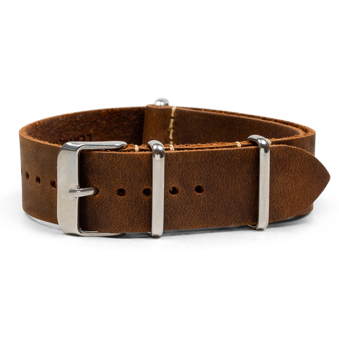 Brown leather watch band with silver buckle on a white background #color_dark-brown