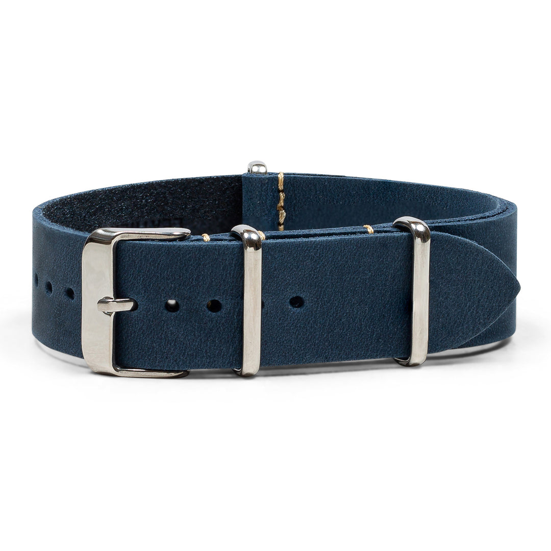 Navy blue leather strap with silver buckle on a white background #color_navy-blue