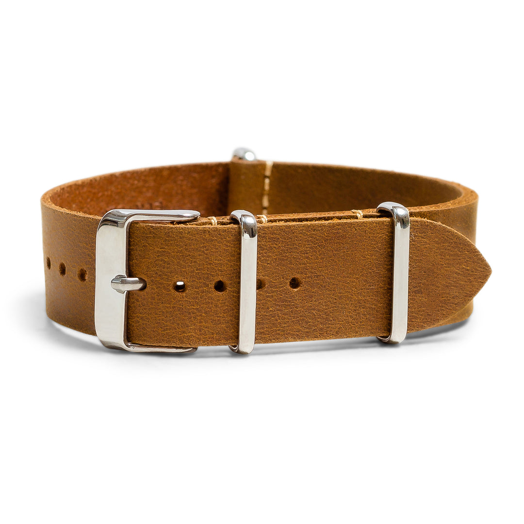 Brown leather watch strap with silver buckle on a white background #color_sand