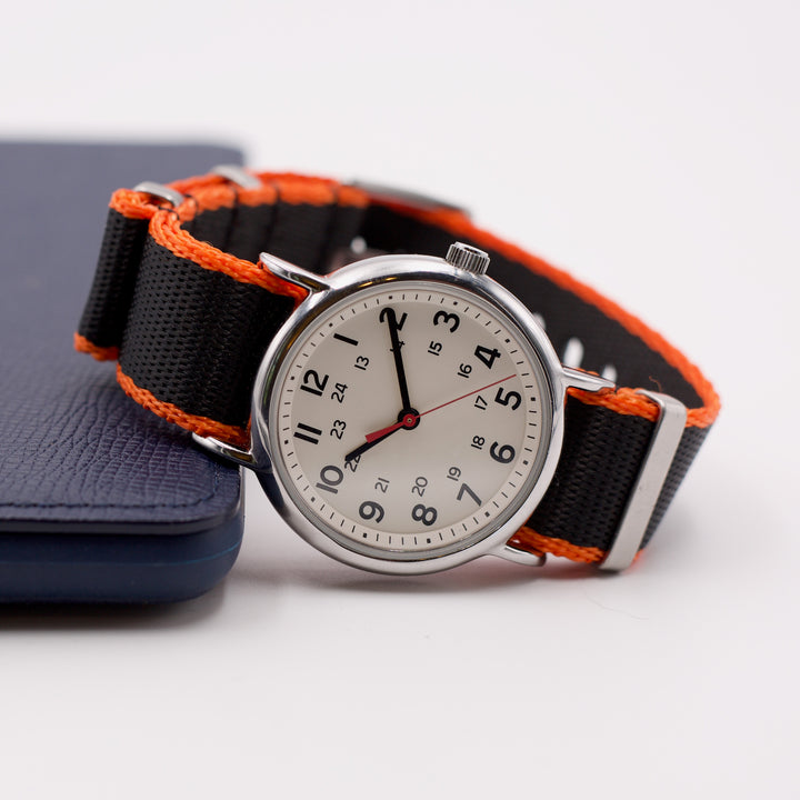 Wristwatch with black and orange strap on a white background #color_black-with-orange-edge
