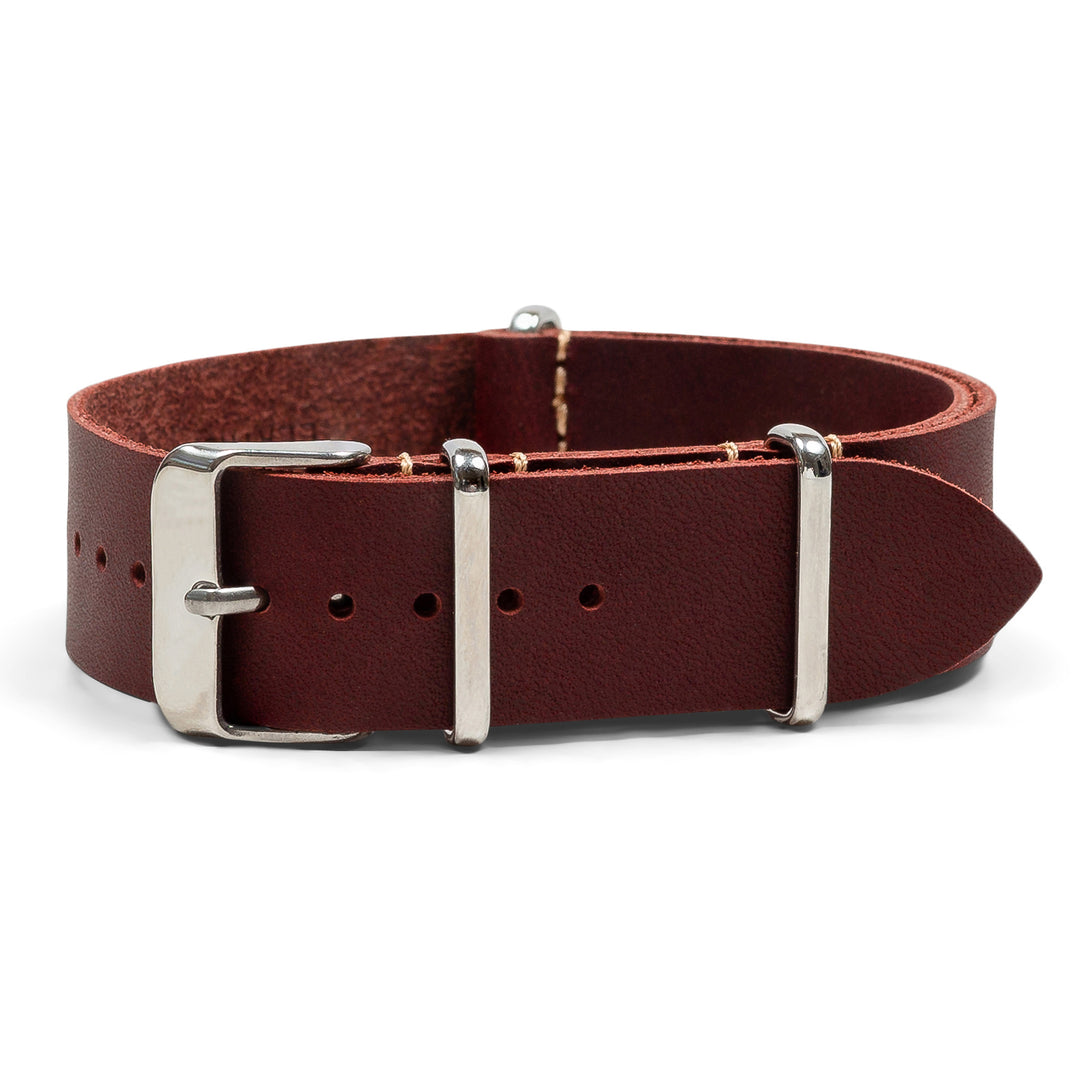 red leather watch band with silver buckle on a white background #color_oxblood