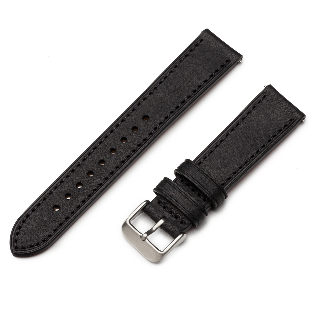 Black leather watch strap with silver buckle on a white background #color_black