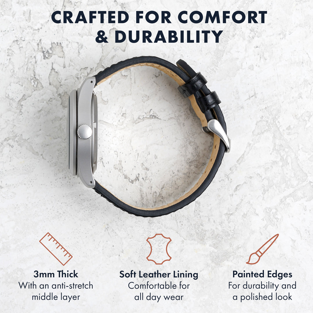 black leather watch band with text highlighting comfort and durability on a light gray background #color_black