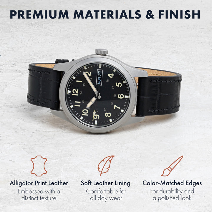 Watch with black leather strap on a light gray background, highlighting premium materials and finish. #color_black