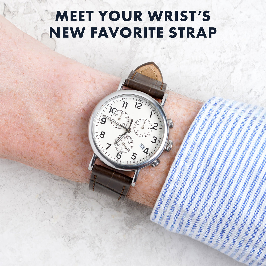 Watch with a brown leather strap on a wrist, text 'Meet your wrist's new favorite strap' above. #color_dark-brown
