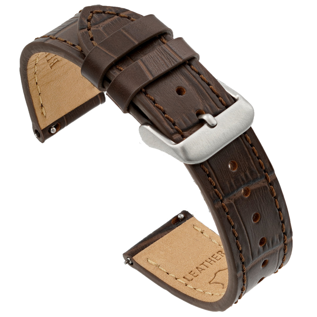 Brown leather watch strap with silver buckle on a white background #color_dark-brown