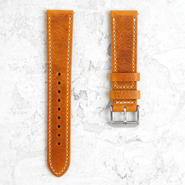 Orange leather watch strap with silver buckle on a light gray background #color_yellow
