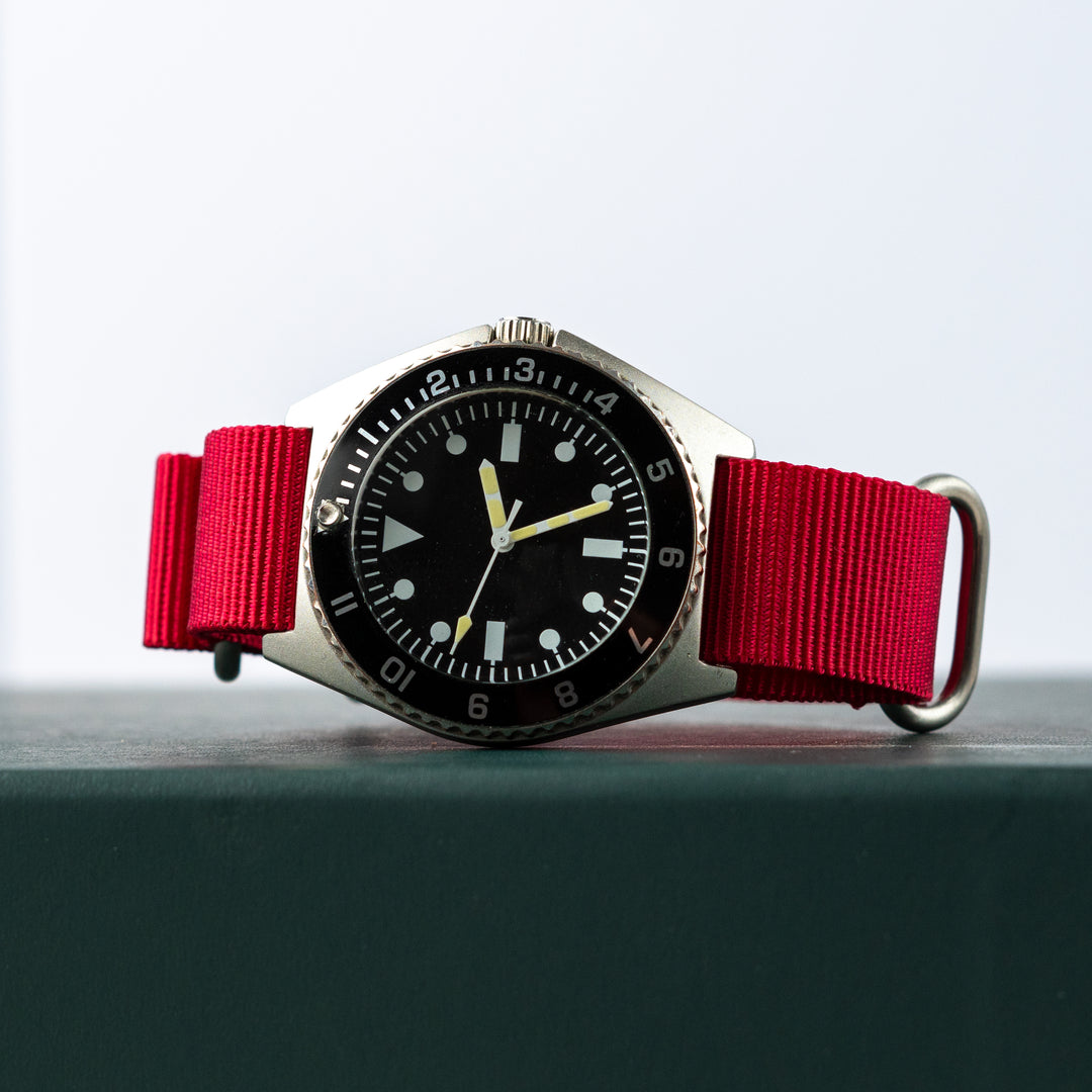 Watch with a red strap on a light gray background #color_red