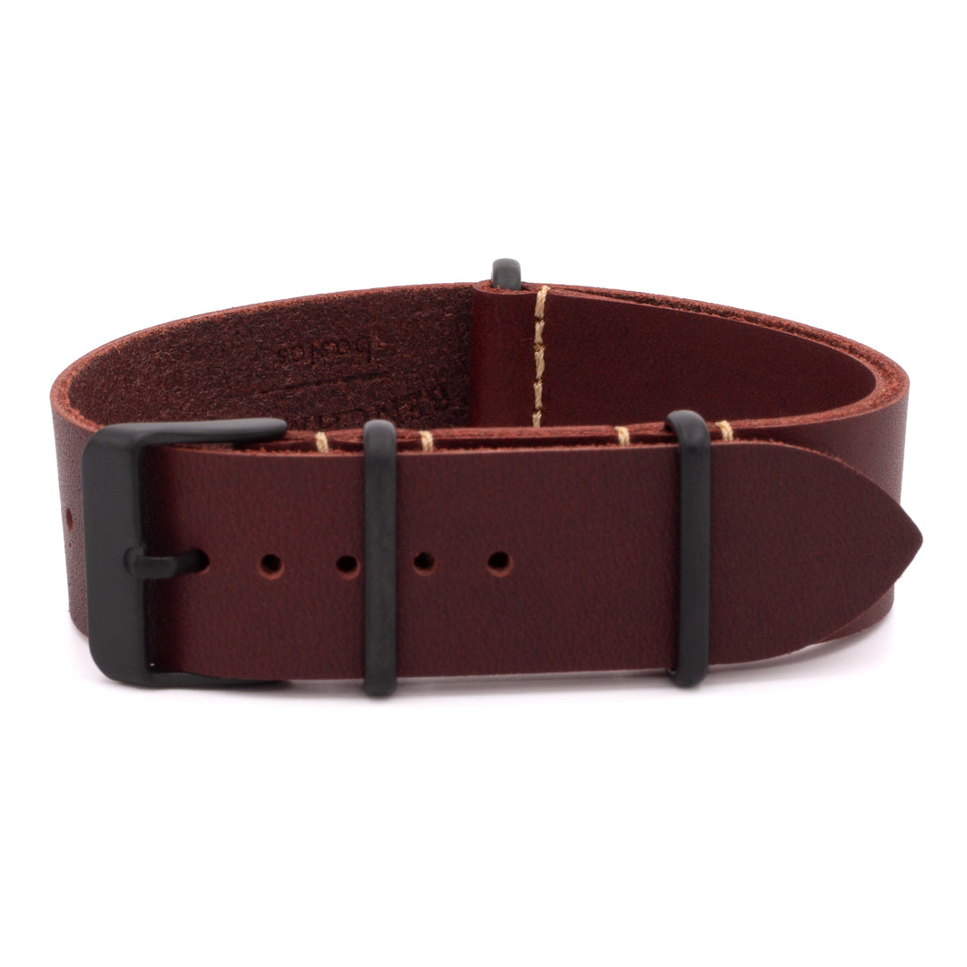 red leather belt with black buckle on a white background #color_oxblood-pvd