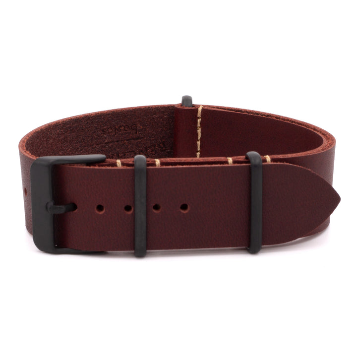red leather belt with black buckle on a white background #color_oxblood-pvd