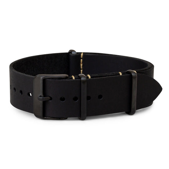 Black leather watch band with gold stitching on a white background #color_black-pvd