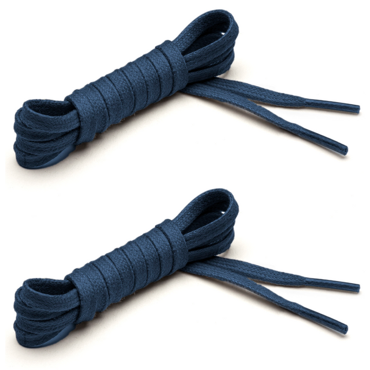 Two pairs of navy flat waxed cotton shoelaces with clear aglets laid out on a white background. #color_navy-blue