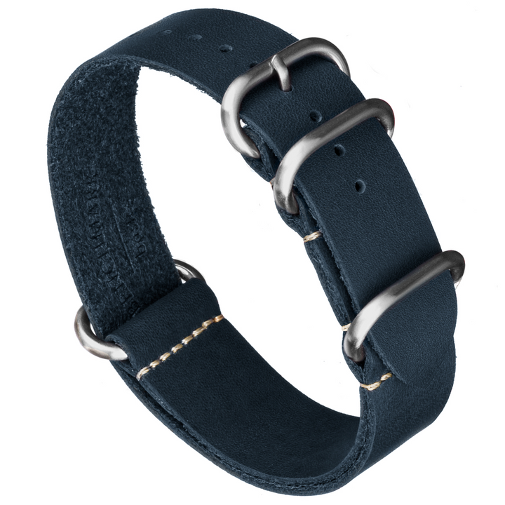 Navy blue oil-tanned leather watch strap with a slip-through design and brushed stainless steel hardware. #color_navy-blue